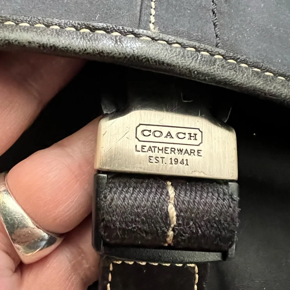 Vintage Coach black nylon leather trimmed flap messenger bag adjustable strap.